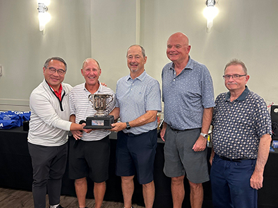 CPABC’s Board Chair, Peter Guo, presents the Team Low Gross trophy to Ben Moxon, Andre Lemieux, Peter Lewis and and Gary Wozny