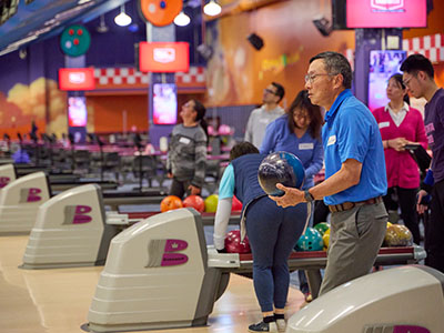 Attendee prepares to bowl